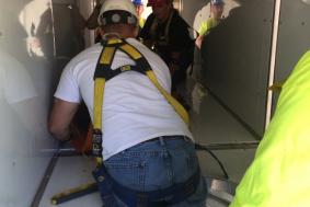Students practicing rope access training in a confined space