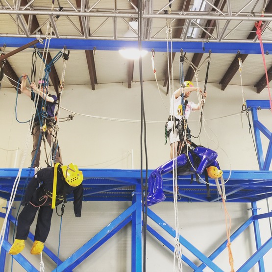 Rope access trainees working with training dummies