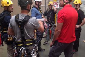Rope access trainees talking in facility