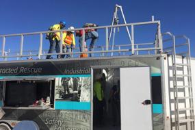 Rope access trainees on top of training facility