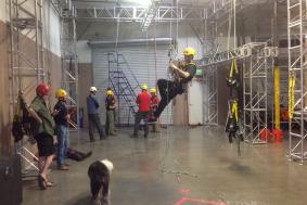 Technician demonstrating to trainees during rope access training