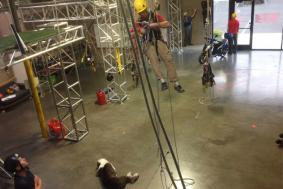 Man practicing rope access training in training facility